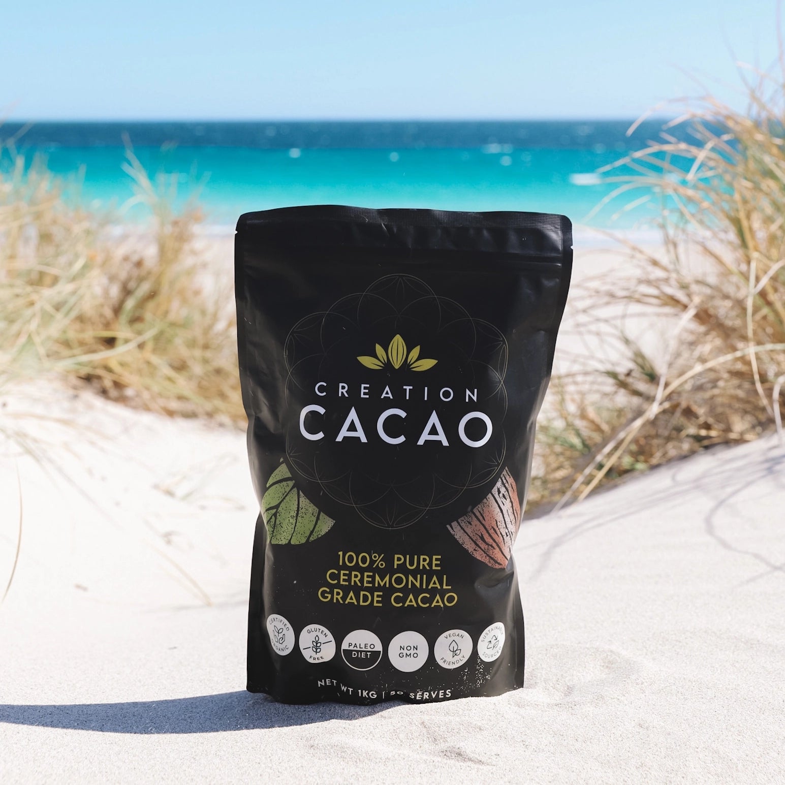 Creation Cacao 1kg Product on the sand at the beach