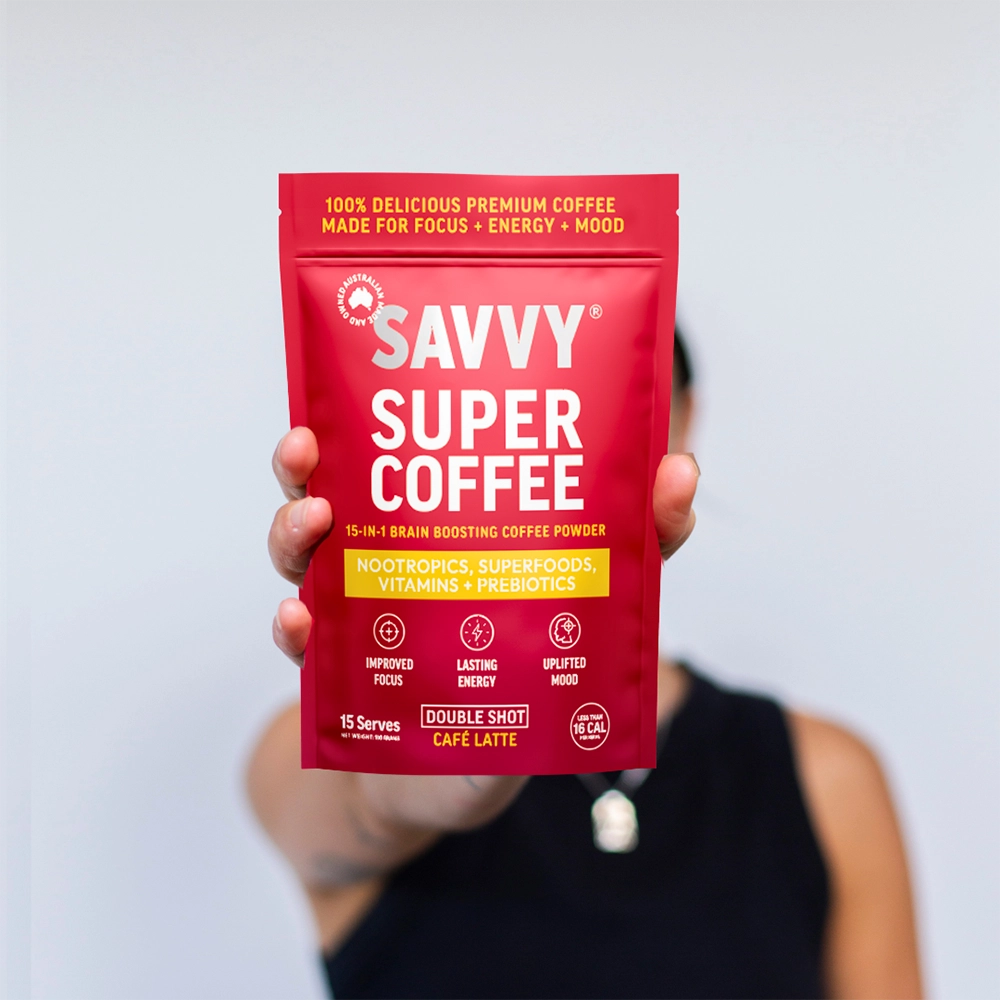 Person holding Savvy Super Coffee 100g Pouch